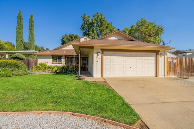 ranch-style home featuring a garage and a front yard