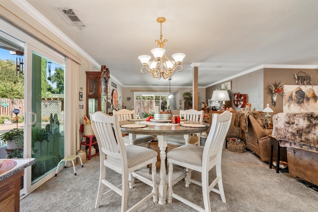 carpeted dining area with crown molding and an inviting chandelier