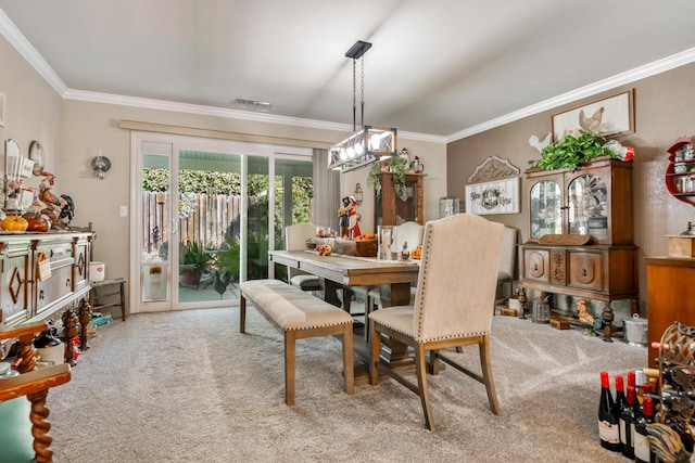 dining area with carpet and crown molding