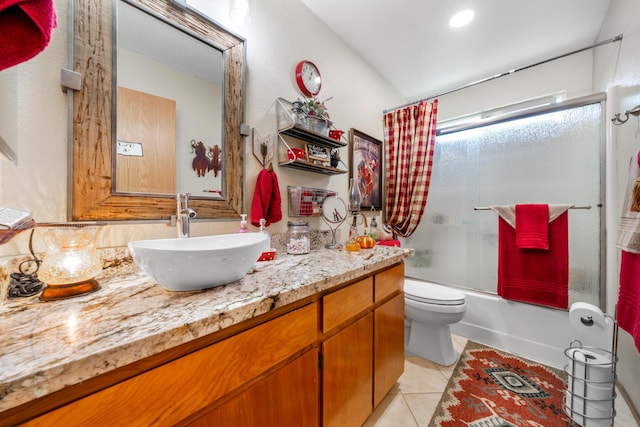 full bathroom featuring vanity, toilet, tile patterned floors, and shower / bath combo with shower curtain