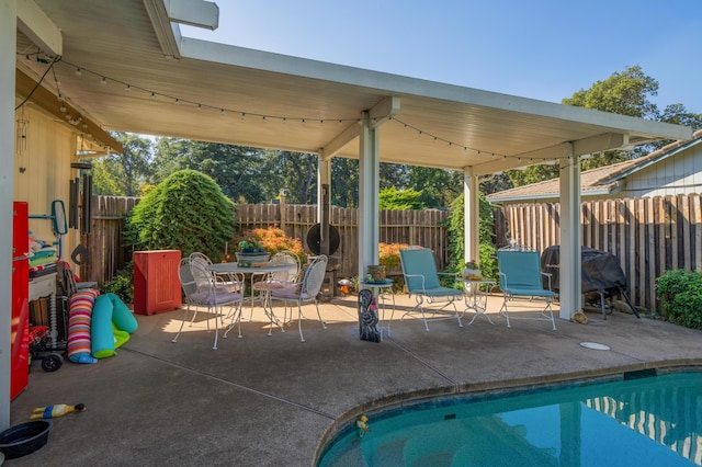 view of swimming pool with a patio area