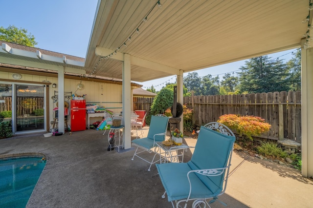 view of patio / terrace featuring a fenced in pool