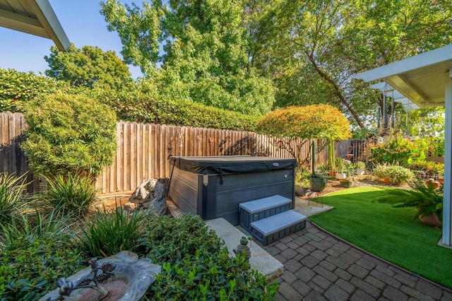 view of patio with a hot tub