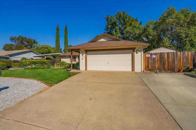 ranch-style home with a garage and a front lawn