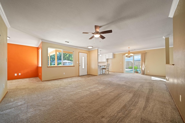 6849 Creekside St, Redding, CA 96001 - unfurnished living room featuring crown molding, a ceiling fan, carpet floors, a chandelier, and healthy amount of natural light