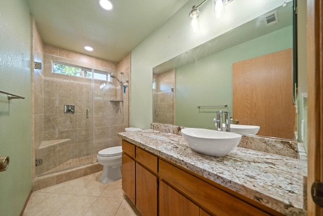 6849 Creekside St, Redding, CA 96001 - bathroom with a shower stall, vanity, toilet, tile patterned floors, and recessed lighting