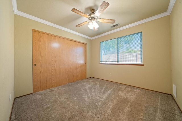 6849 Creekside St, Redding, CA 96001 - unfurnished bedroom with carpet, a closet, crown molding, and ceiling fan