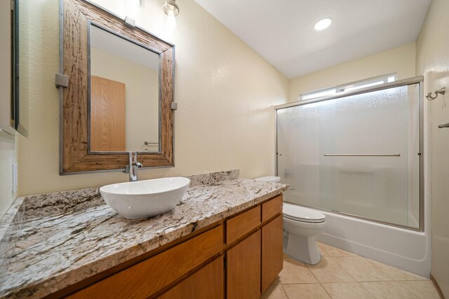 6849 Creekside St, Redding, CA 96001 - full bath featuring vanity, toilet, tile patterned floors, and enclosed tub / shower combo
