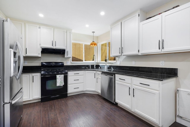 kitchen featuring dark hardwood / wood-style flooring, decorative light fixtures, sink, stainless steel appliances, and white cabinetry