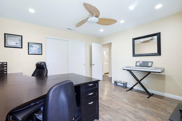 office space with hardwood / wood-style floors and ceiling fan