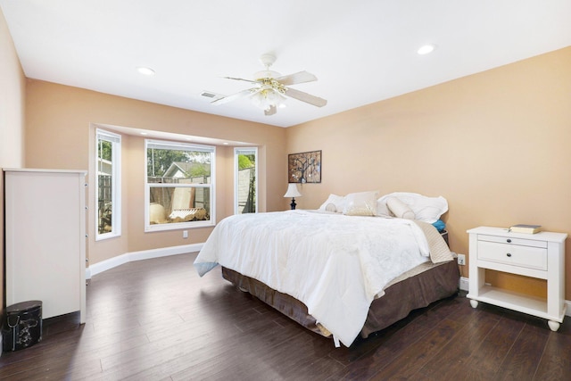 bedroom featuring dark hardwood / wood-style floors and ceiling fan