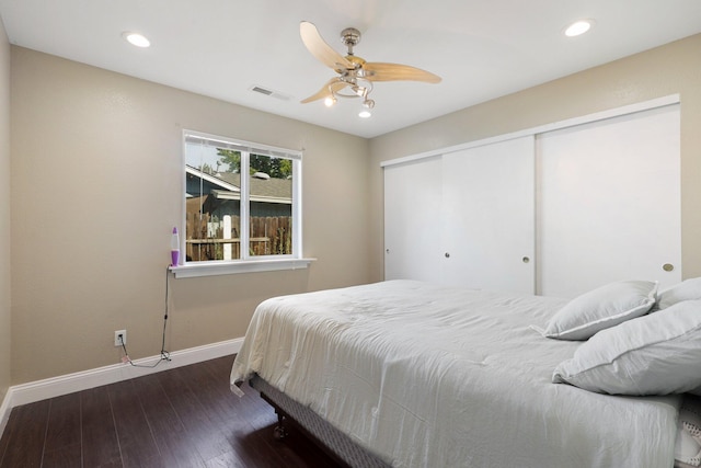 bedroom featuring dark wood-type flooring and ceiling fan