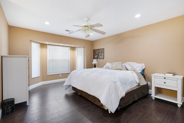 bedroom with ceiling fan and dark hardwood / wood-style flooring