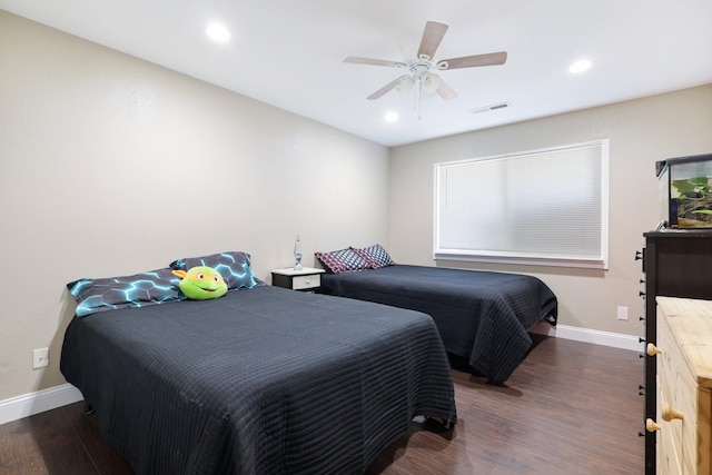 bedroom featuring ceiling fan and dark hardwood / wood-style flooring