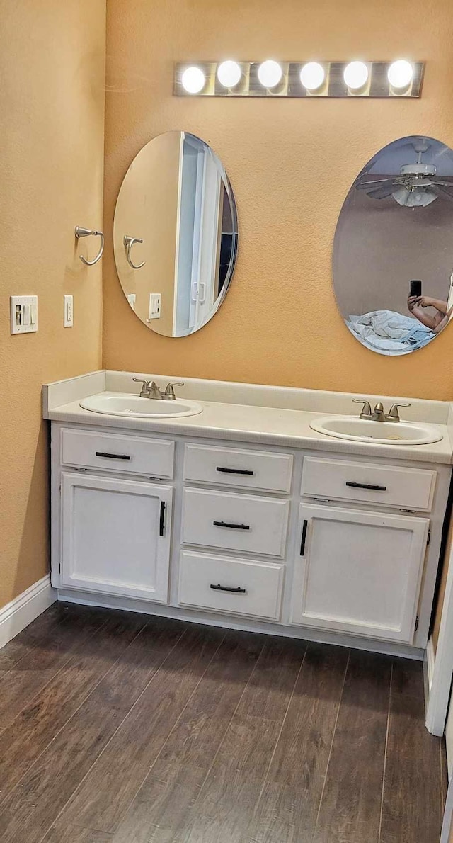 bathroom featuring vanity and hardwood / wood-style flooring