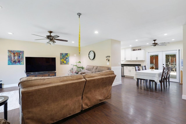 living room featuring dark wood-type flooring, french doors, and ceiling fan