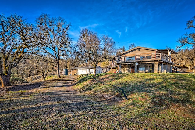 back of house with a lawn