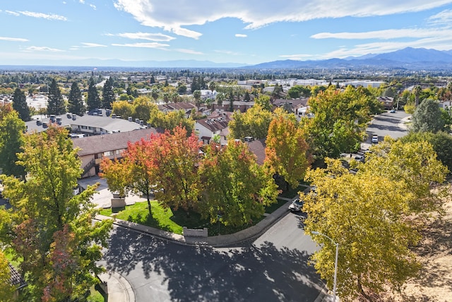 birds eye view of property with a mountain view