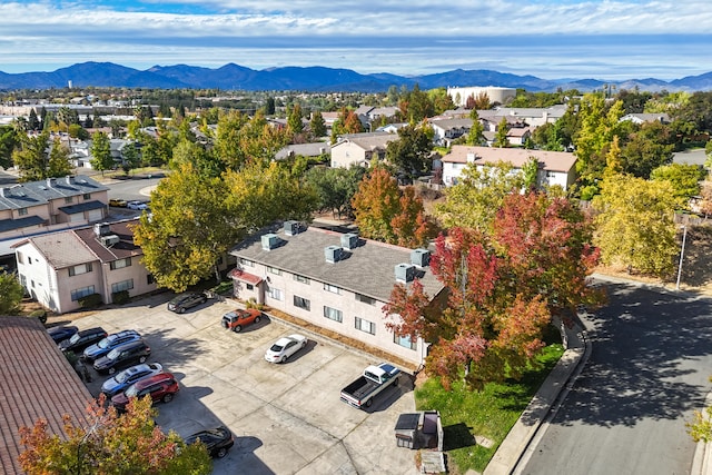 drone / aerial view featuring a mountain view