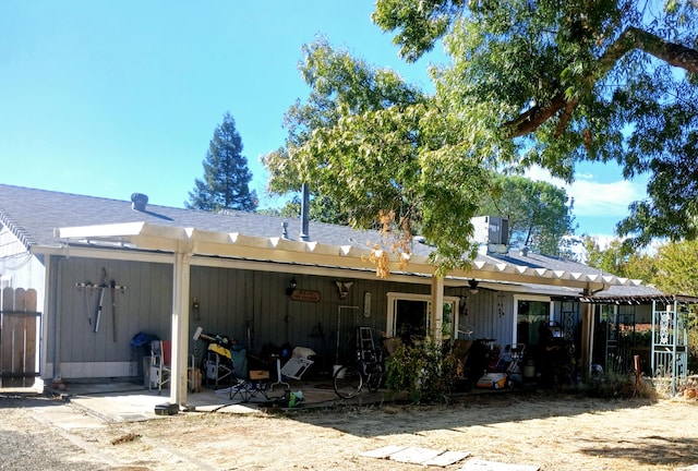 back of house with a patio