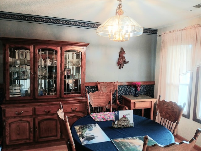 dining room featuring a chandelier