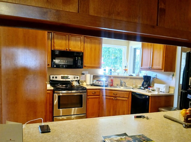 kitchen with black appliances and sink