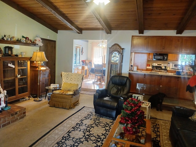 carpeted living room with lofted ceiling with beams, ceiling fan, and wooden ceiling