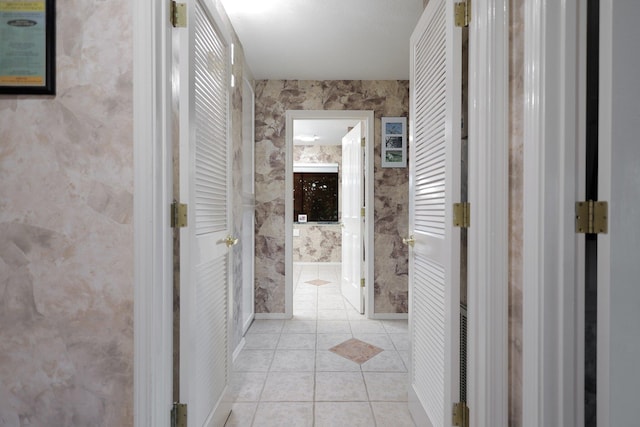 hall featuring light tile patterned floors