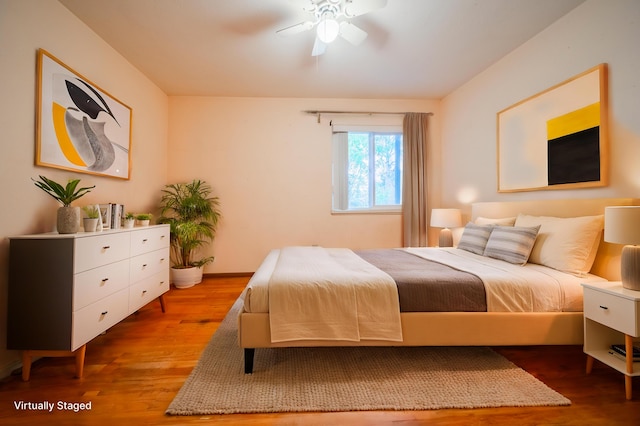 bedroom featuring hardwood / wood-style floors and ceiling fan