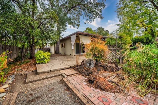 back of property with a patio area