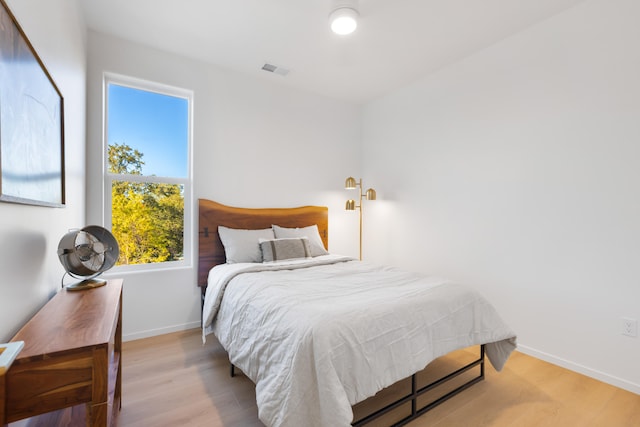 bedroom with light wood-type flooring