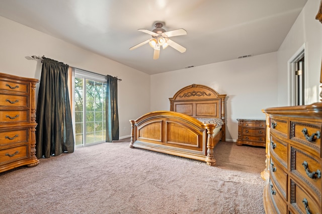 carpeted bedroom featuring access to outside and ceiling fan