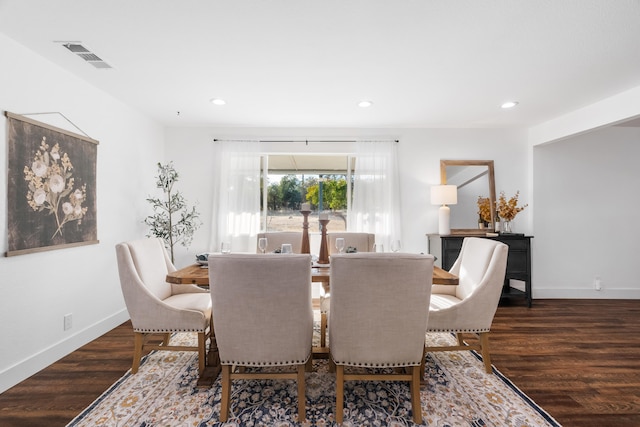 dining space with dark wood-type flooring