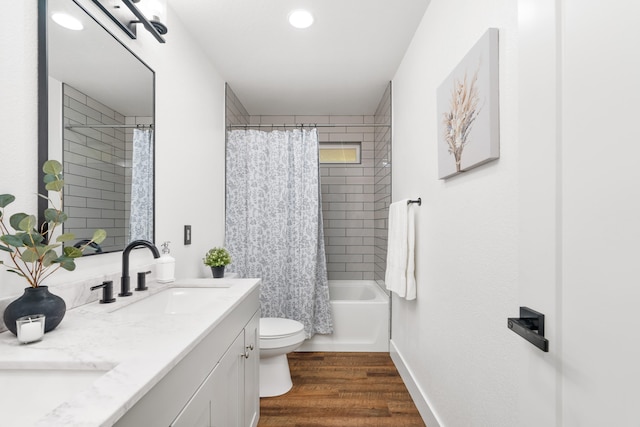 full bathroom with vanity, toilet, wood-type flooring, and shower / bath combination with curtain