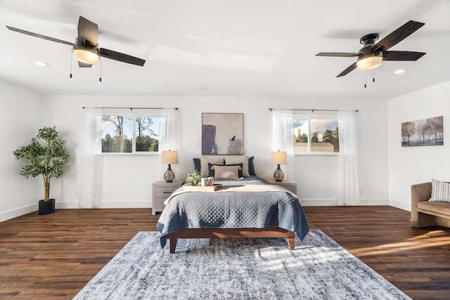 bedroom featuring ceiling fan and dark hardwood / wood-style floors