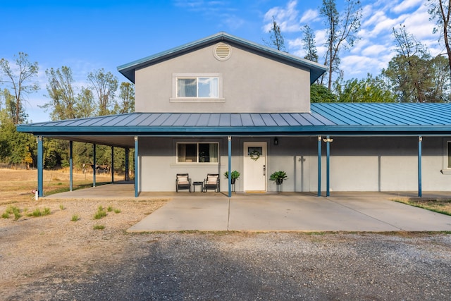 country-style home with a carport