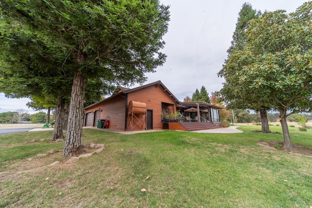 exterior space featuring a yard and a garage