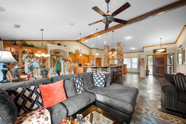 living room featuring crown molding, lofted ceiling with beams, and ceiling fan with notable chandelier