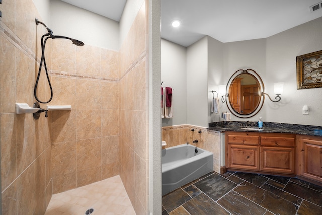 bathroom featuring vanity and separate shower and tub