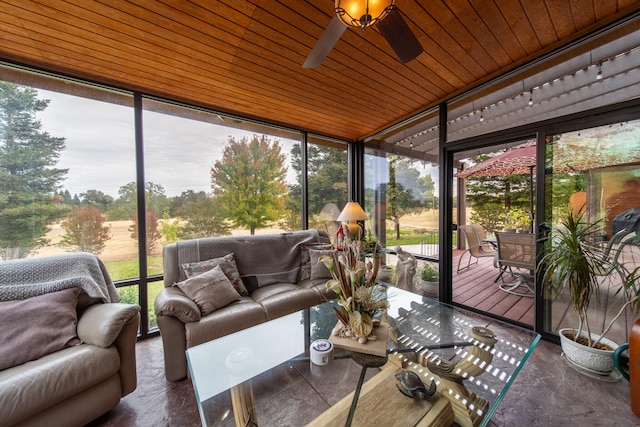 sunroom / solarium featuring wood ceiling and ceiling fan