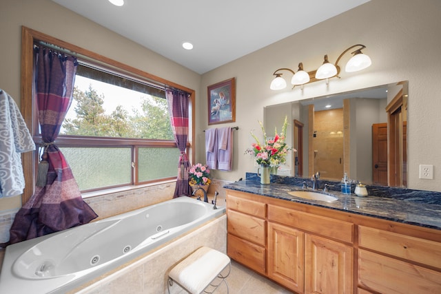 bathroom featuring vanity and separate shower and tub