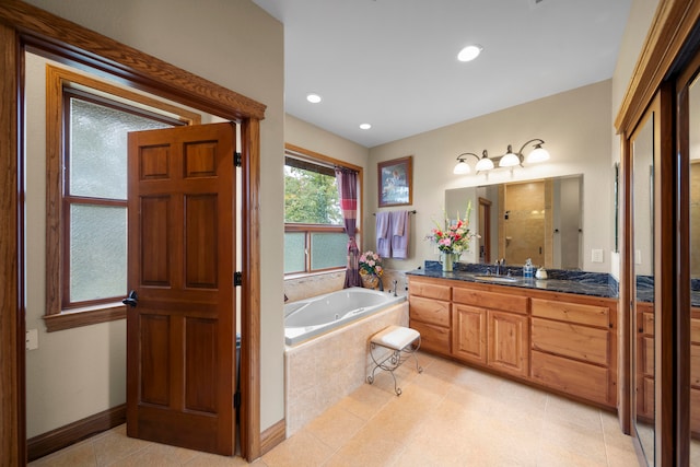 bathroom with vanity, shower with separate bathtub, and tile patterned floors