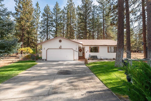 view of front facade featuring a garage and a front lawn