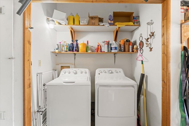 clothes washing area with independent washer and dryer