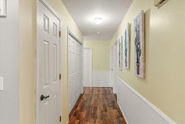 corridor featuring dark wood-type flooring