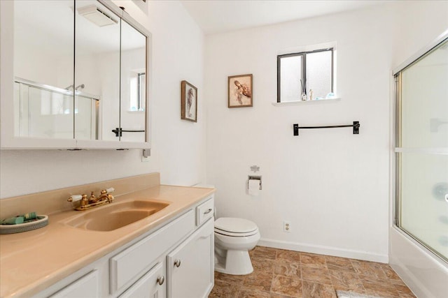 full bathroom with vanity, toilet, and enclosed tub / shower combo