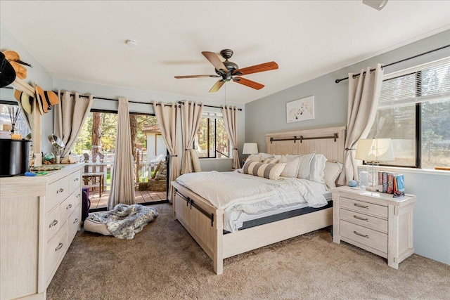 bedroom with light carpet, access to outside, and ceiling fan