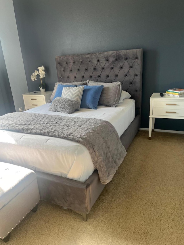 bedroom featuring light colored carpet