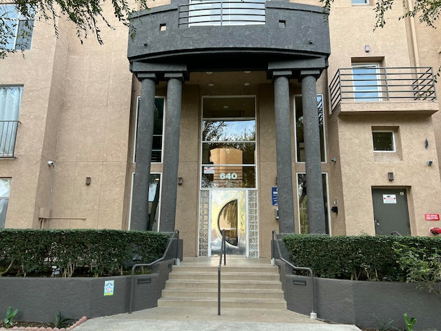 doorway to property with a balcony