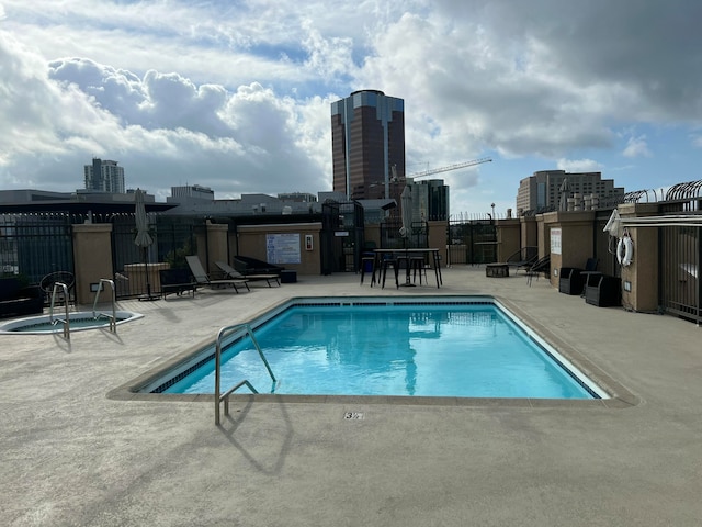 view of swimming pool with a patio area